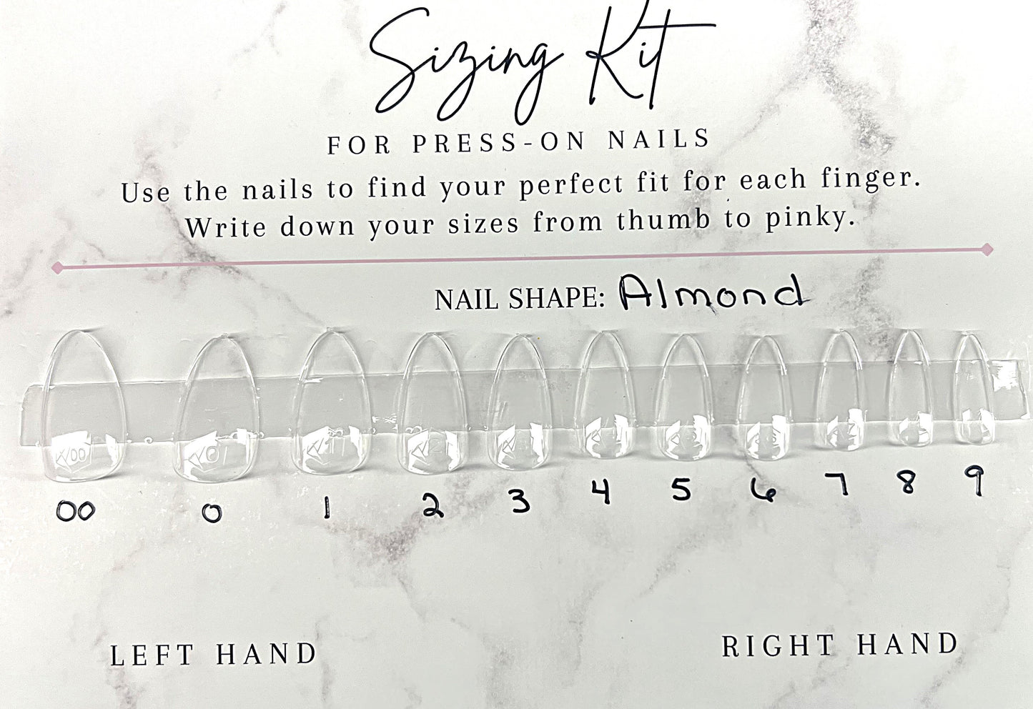 Astral Hue Sizing Kit for press-on nails. A white marble-patterned card featuring 11 clear Après Gel-X almond-shaped nail tips labeled 00 through 9. Includes instructions to find the perfect fit and spaces to write down sizes for the left and right hands.