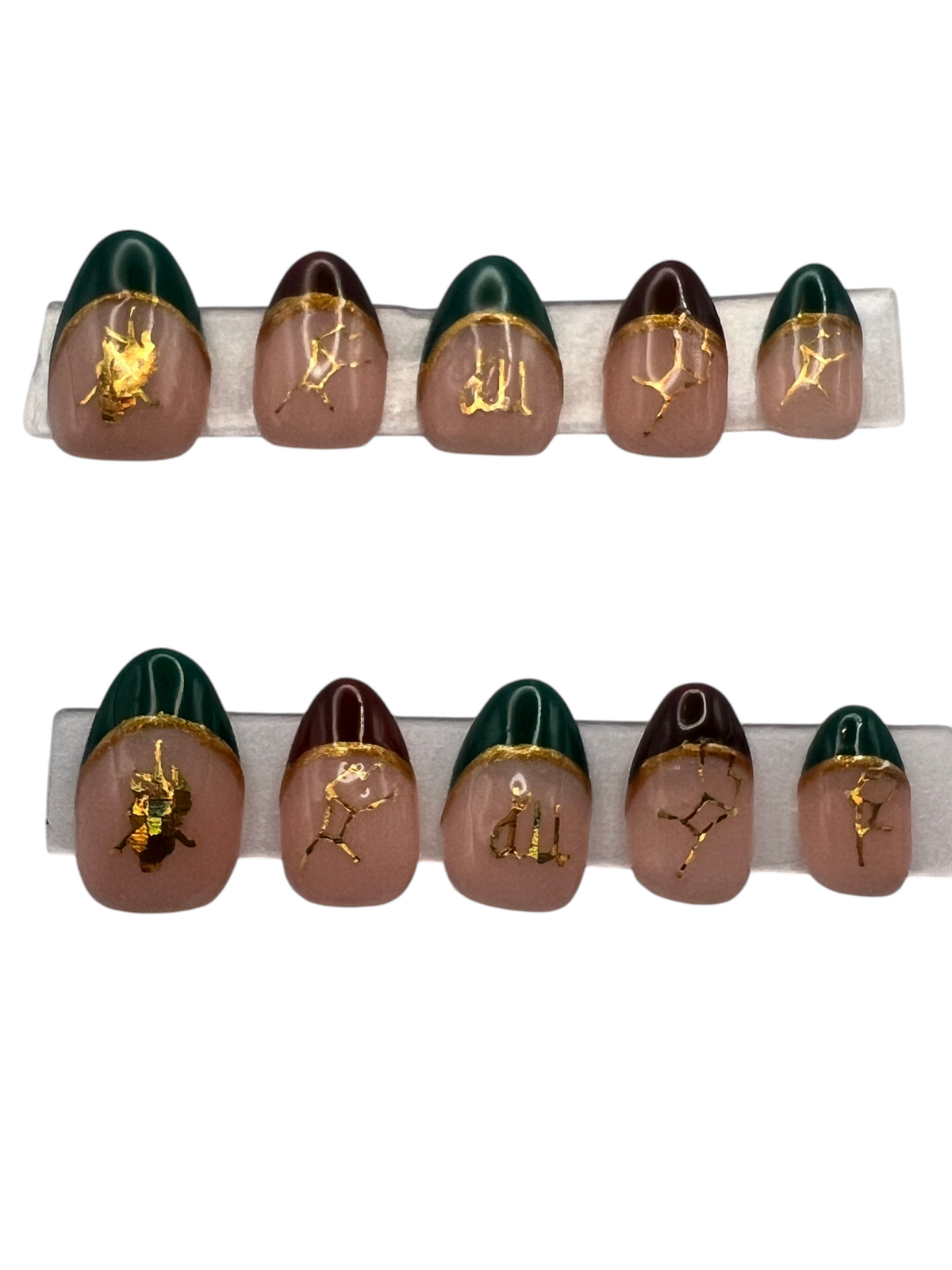 Extra short almond-shaped press-on nails featuring a soft nude base with a mix of deep forest green and chocolate brown French tips. Each smile line is bordered with a metallic gold hand-painted line, and gold holographic Virgo zodiac decals and constellations are centered on each nail bed.
