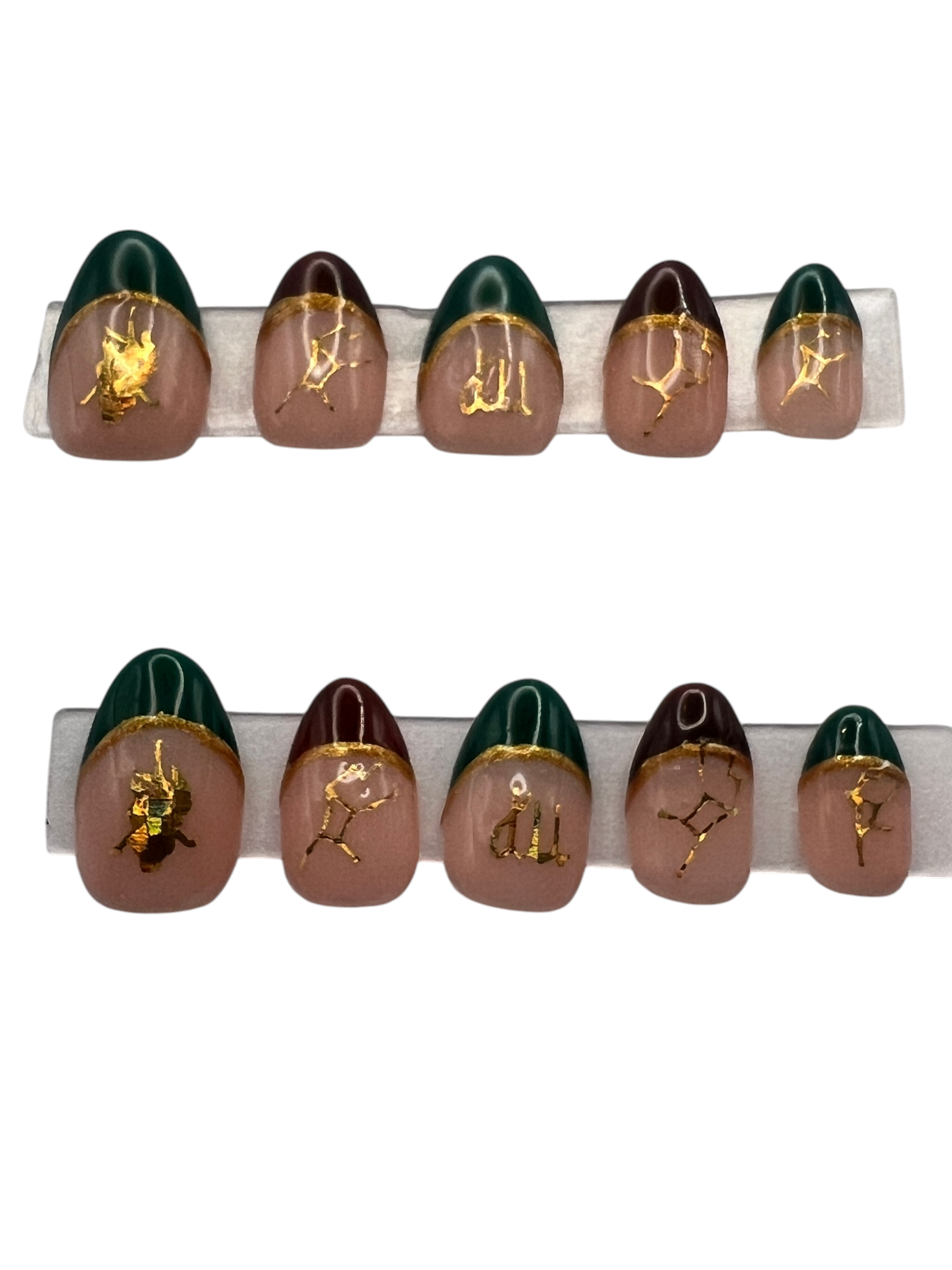 Extra short almond-shaped press-on nails featuring a soft nude base with a mix of deep forest green and chocolate brown French tips. Each smile line is bordered with a metallic gold hand-painted line, and gold holographic Virgo zodiac decals and constellations are centered on each nail bed.